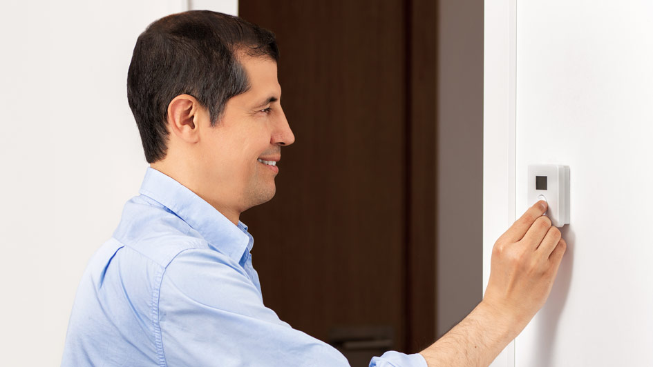 setting the temperature on a thermostat