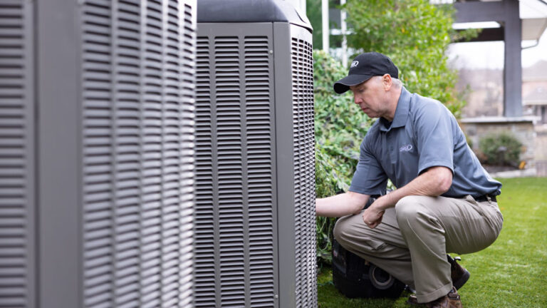 tech with outdoor hvac units