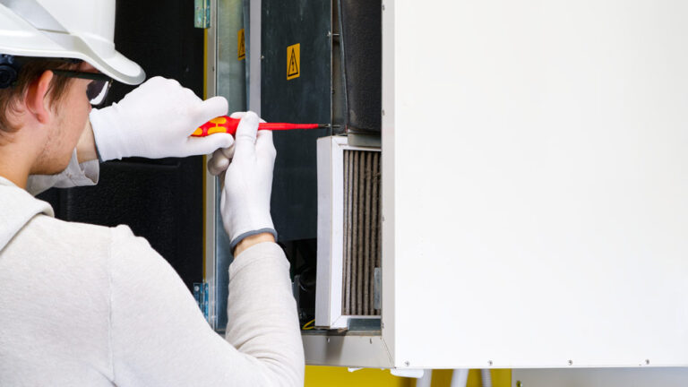 tech repairing a furnace